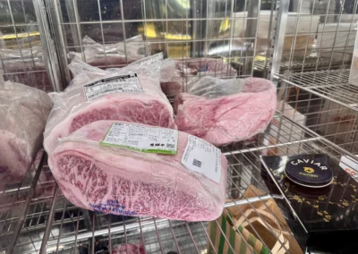 Premium A5 Wagyu strip loin showcased in a refrigerator.