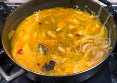 Hot and sour soup with onions and wood ear mushrooms.