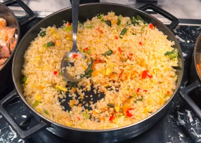 Wok-fried vegetable fried rice with bell peppers and scallions.