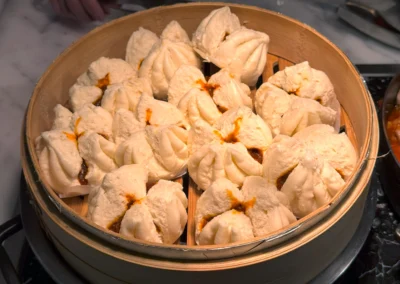 Freshly steamed bao buns filled with savory pork.
