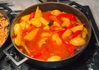 Vegetable curry with potatoes and bell peppers.