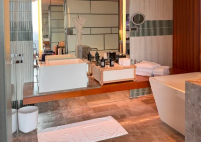 Spacious bathroom vanity area in the Fabulous Room at W Taipei, with illuminated mirrors and contemporary decor.