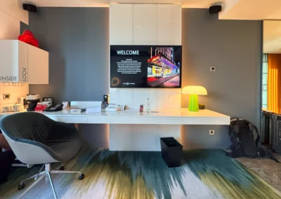 Desk area in the Fabulous Room, Corner Unit at W Taipei, with a large workspace, mounted TV, and stylish decor.