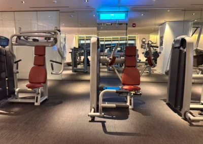 Strength training machines in the FIT gym at W Taipei, arranged in a spacious and well-lit workout area.