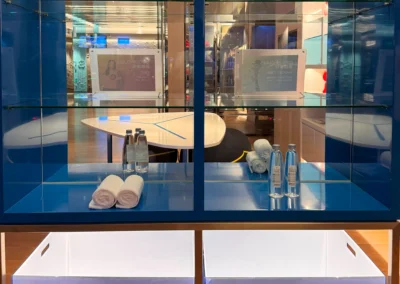 Towel recycling station inside the FIT gym at W Taipei, offering fresh towels and complimentary bottled water for guests.