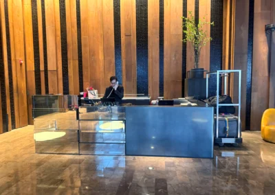 Lower lobby concierge desk, handling luggage and guest services.