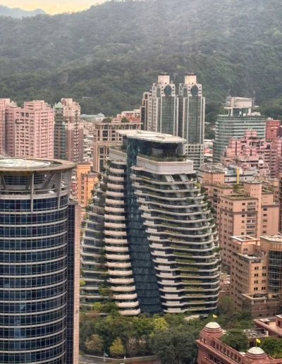 View of the futuristic Tao Zhu Yin Yuan Tower, a twisting green skyscraper in Taipei, as seen from YEN restaurant at W Taipei.