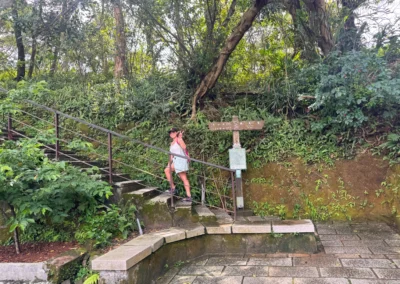 Trail sign marking Hushan 120 Heights and Tiger Mountain Peak.